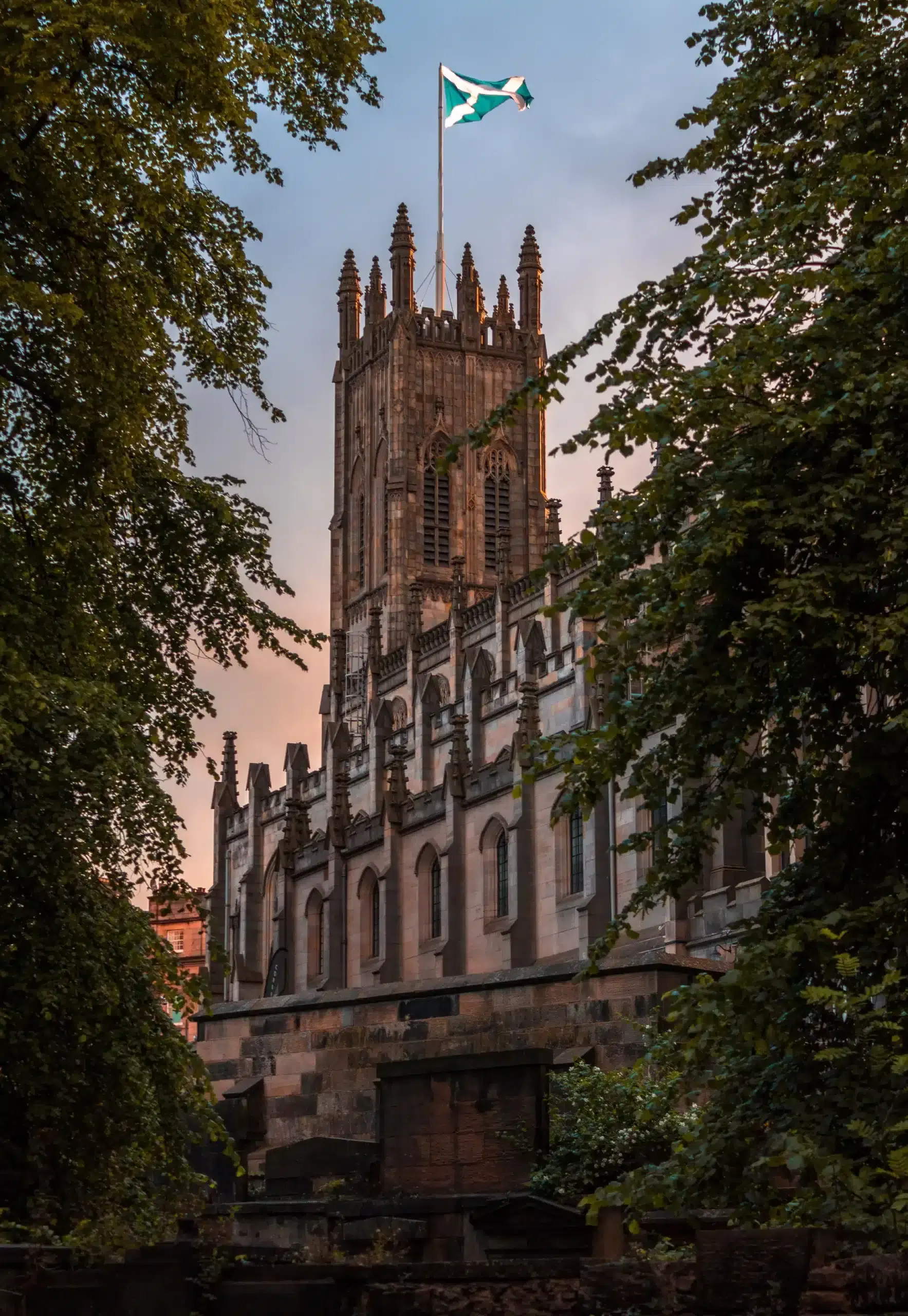 Picture of a historical building with the Scottish flag